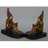 A PAIR OF ART DECO GILDED BRONZE BOOKENDS on black marble bases. 4.5ins long.