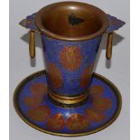 AN ISLAMIC BRONZE AND ENAMEL TWO HANDLED POT with liner and swing handles. 5.5ins high.