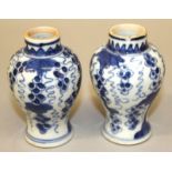 A SMALL PAIR OF CHINESE KANGXI PERIOD BLUE & WHITE PORCELAIN VASES, each painted with hanging vines,