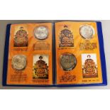 A CHINESE ALBUM OF COINS, consisting of 12 coins.