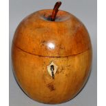 AN APPLE FRUITWOOD TEA CADDY with mother of pearl escutcheon and tin lined interior. 5.5ins high.