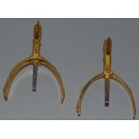 A PAIR OF LEFT AND RIGHT GILT BRASS BRITISH MILITARY SPURS decorated with crowns, acorns and oak