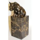 MILO A BRONZE SEATED RHINO. 4ins high, on a marble plinth.