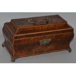 A GEORGE III MAHOGANY SHAPED JEWELLERY CASKET with silver handles, escutcheons and feet. 10ins wide.