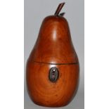 A PEAR FRUITWOOD TEA CADDY with metal escutcheon. 7ins high.