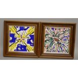 A PAIR OF SALVADOR DALI SQUARE TILES 1954 in wooden frames. 7.5ins.