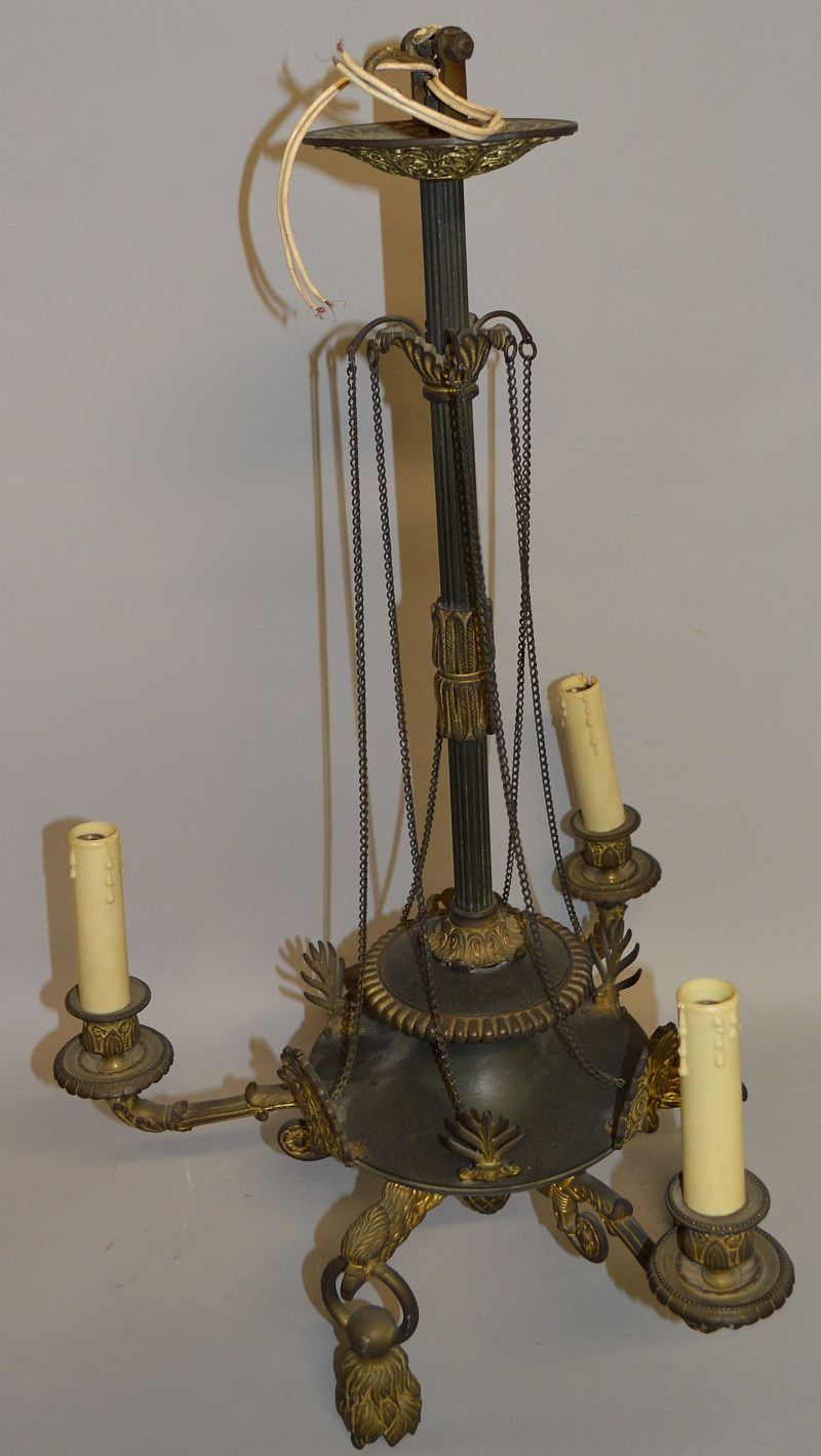 A REGENCY BRONZE AND GILT THREE BRANCH CHANDELIER with scrolling branches, anthemion mounts and