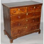 AN 18TH CENTURY OAK AND MAHOGANY CROSSBANDED STRAIGHT FRONT CHEST of two short and three long,