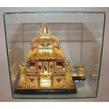 A SOUTH-EAST ASIAN GILT METAL MODEL OF A TEMPLE, with onlaid filigree decoration and inset stones,