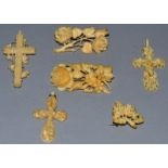 THREE CARVED IVORY BROOCHES AND THREE CROSSES.