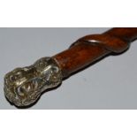 A SPIRAL CANE with silver handle. 30ins long.