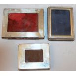 THREE SMALL SILVER FRENCH PHOTOGRAPH FRAMES.