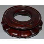 A CHINESE HARDWOOD CIRCULAR STAND. 5.5ins diameter.