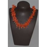 A CORAL SINGLE STRAND NECKLACE.