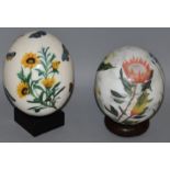 TWO PAINTED OSTRICH EGGS.
