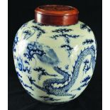 A 19TH CENTURY CHINESE BLUE & WHITE PORCELAIN DRAGON JAR, with a hardwood cover, the cover pierced