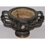 A 19TH CENTURY FRENCH BRONZE OF THE WARWICK VASE with entwined handles and masks around the