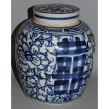 AN 18TH CENTURY STYLE BLUE AND WHITE GINGER JAR AND COVER. 9ins high.