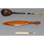 A TREEN OWL PAPERWEIGHT, miniature ivory cricket bat and a Persian spoon with mother of pearl