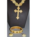 A CARVED IVORY NECKLACE AND CROSS WITH BRACELET AND INLAID STONE.