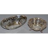 AN OVAL PIERCED BONBON DISH, 7.5ins long, Birmingham 1909, and a CIRCULAR SHAPED BONBON DISH,