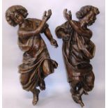 A FINE PAIR OF 17TH CENTURY FLEMISH CARVED OAK CHERUBS, well carved with curled hair, mouths