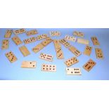 A LARGE WOODEN DOMINO SET in wooden case. 11.5ins wide.