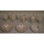 A SET OF EIGHT CUT SHERRY GLASSES with engraved deer’s crest in an oval and THREE MATCHING FINGER