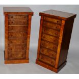 A GOOD PAIR OF WALNUT BEDSIDE CUPBOARDS formed as a set of seven Wellington type drawers forming a