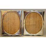 A PAIR OF HUNGARIAN OVAL UPRIGHT EASEL PHOTOGRAPH FRAMES. 5ins high x 4ins wide.