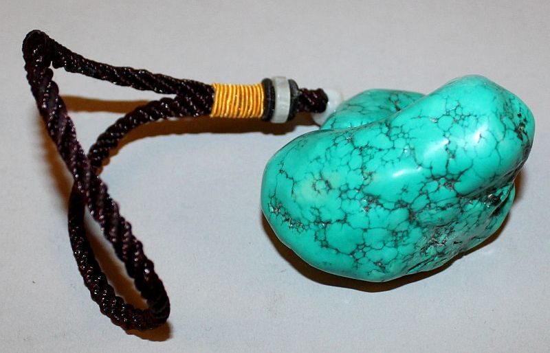A CHINESE TURQUOISE-LIKE PENDANT, of boulder form, with attached tassel, the pendant 2.4in wide & - Image 2 of 2