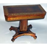 A SUPERB REGENCY ROSEWOOD BRASS INLAID CARD TABLE with folding top and blue baize interior, centre