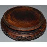 A CHINESE HARDWOOD CIRCULAR STAND. 5ins diameter.