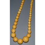 AN IVORY EIGHT BEAD NECKLACE.