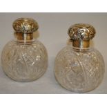 A PAIR OF SILVER TOP CUT GLASS BALL SHAPED SCENT BOTTLES.  Birmingham 1900.