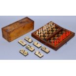 A BONE AND EBONY SET OF DOMINOES in a wooden box, 6ins long, and a TRAVELLING CHESS SET in a