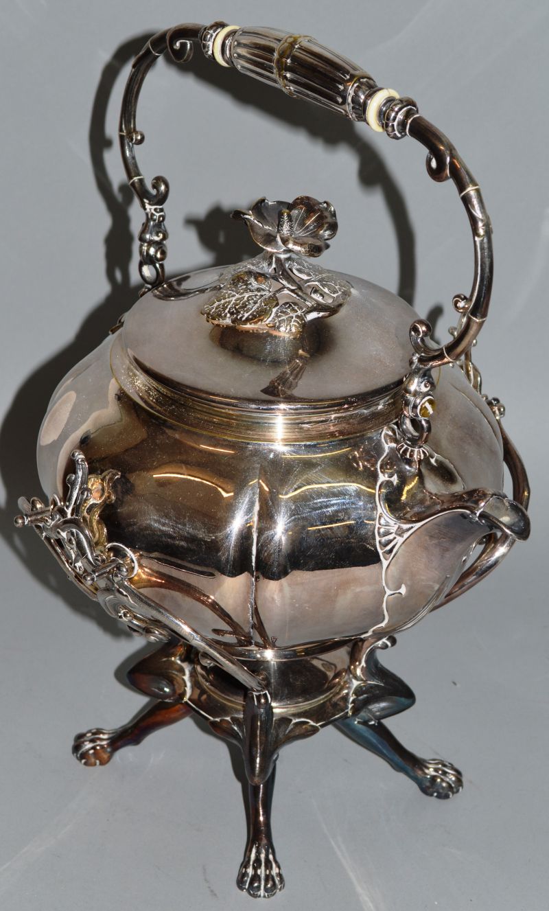 A VICTORIAN PLATE SPIRIT KETTLE ON STAND.