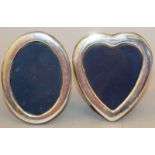 A PLAIN HEART SHAPED EASEL PHOTOGRAPH FRAME AND AN OVAL PHOTOGRAPH FRAME. (2)