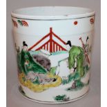 A CHINESE FAMILLE VERTE PORCELAIN BRUSHPOT, decorated with figures in a fenced garden setting, 5in