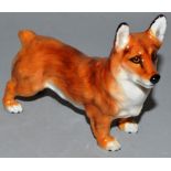 A ROYAL DOULTON MODEL OF A STANDING CORGI.