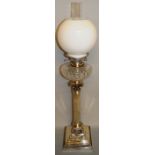 A VERY GOOD PLATE CORINTHIAN COLUMN OIL LAMP with glass reservoir and globe.