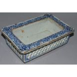 A SMALL CHINESE BLUE AND WHITE RECTANGULAR PLATE with pierced sides. 6.5ins wide.