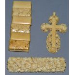 A CARVED IVORY BRACELET, A CROSS AND A BROOCH.