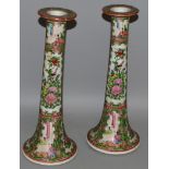 A PAIR OF CANTONESE TAPERING CANDLESTICKS, typical design. 11ins high.