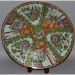 A CANTONESE CIRCULAR DISH with all-over design, panels of flowers and figures. Circa. 1820. 13ins