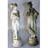 A NEAR PAIR OF RECONSTITUTED FIGURES OF STANDING FEMALE FIGURES in classical pose. Each 2ft 2ins