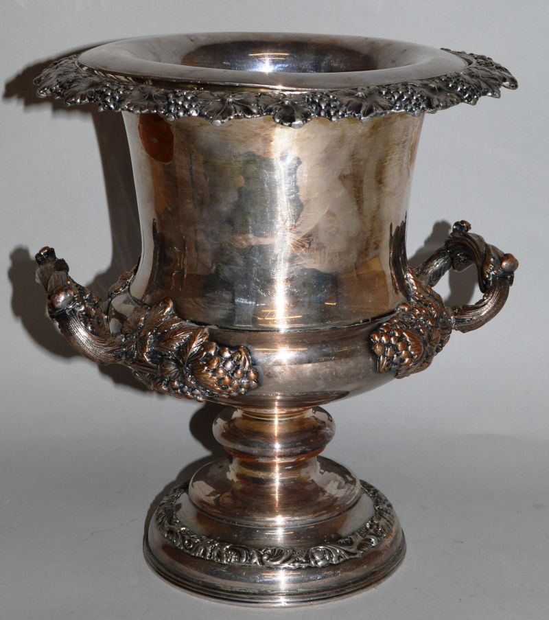 A PLATED TWO HANDLED URN SHAPED WINE COOLER decorated with fruiting vines.