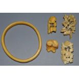 A PLAIN IVORY BRACELET AND FOUR BROOCHES.