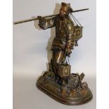 A GOOD GILDED BRONZED FIGURE OF A CHINA MAN carrying a pole with baskets. 10.5ins high.