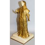 A. OUVET A GOOD GILDED BRONZE AND IVORY FIGURE OF A STANDING LADY READING. Signed. 9.5ins high, on